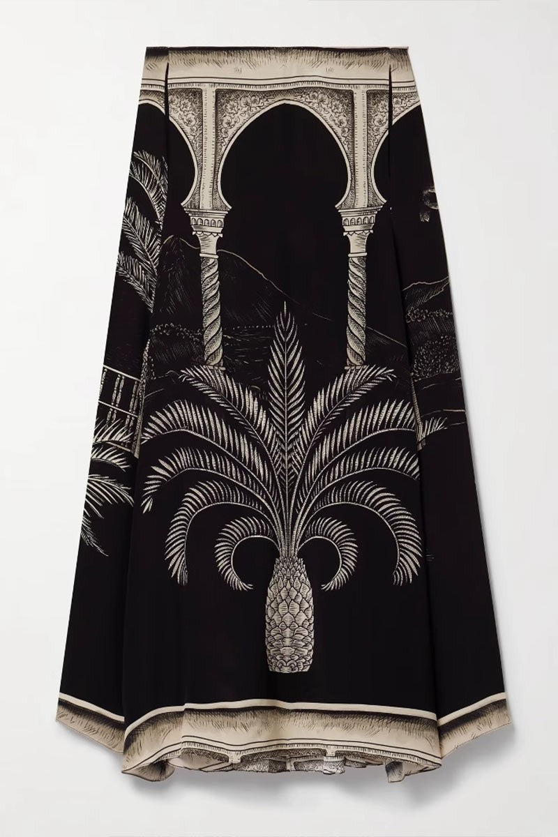 Flat lay detail of the skirt's architectural palm print design.