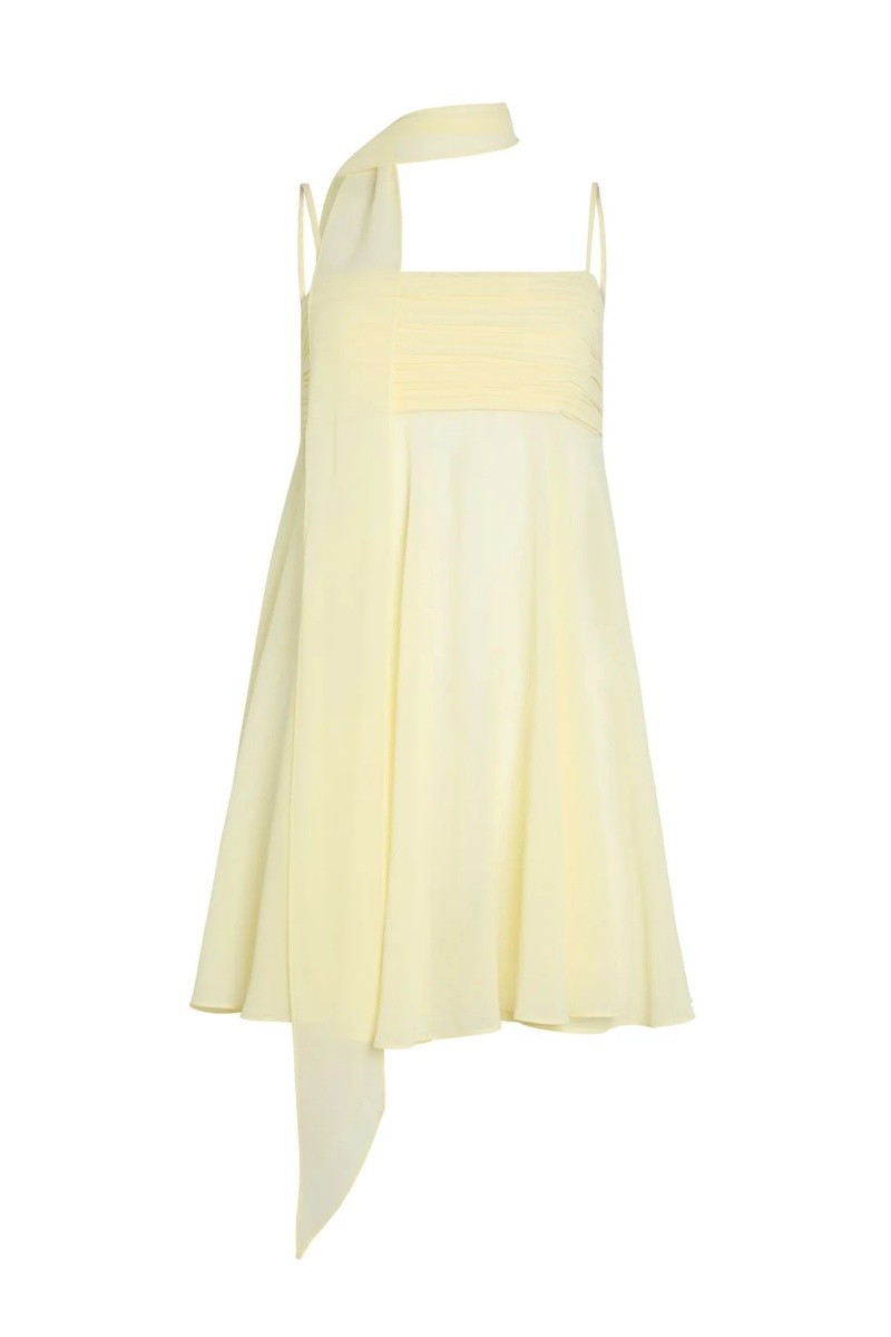 Flat lay of yellow chiffon mini dress with matching scarf tie