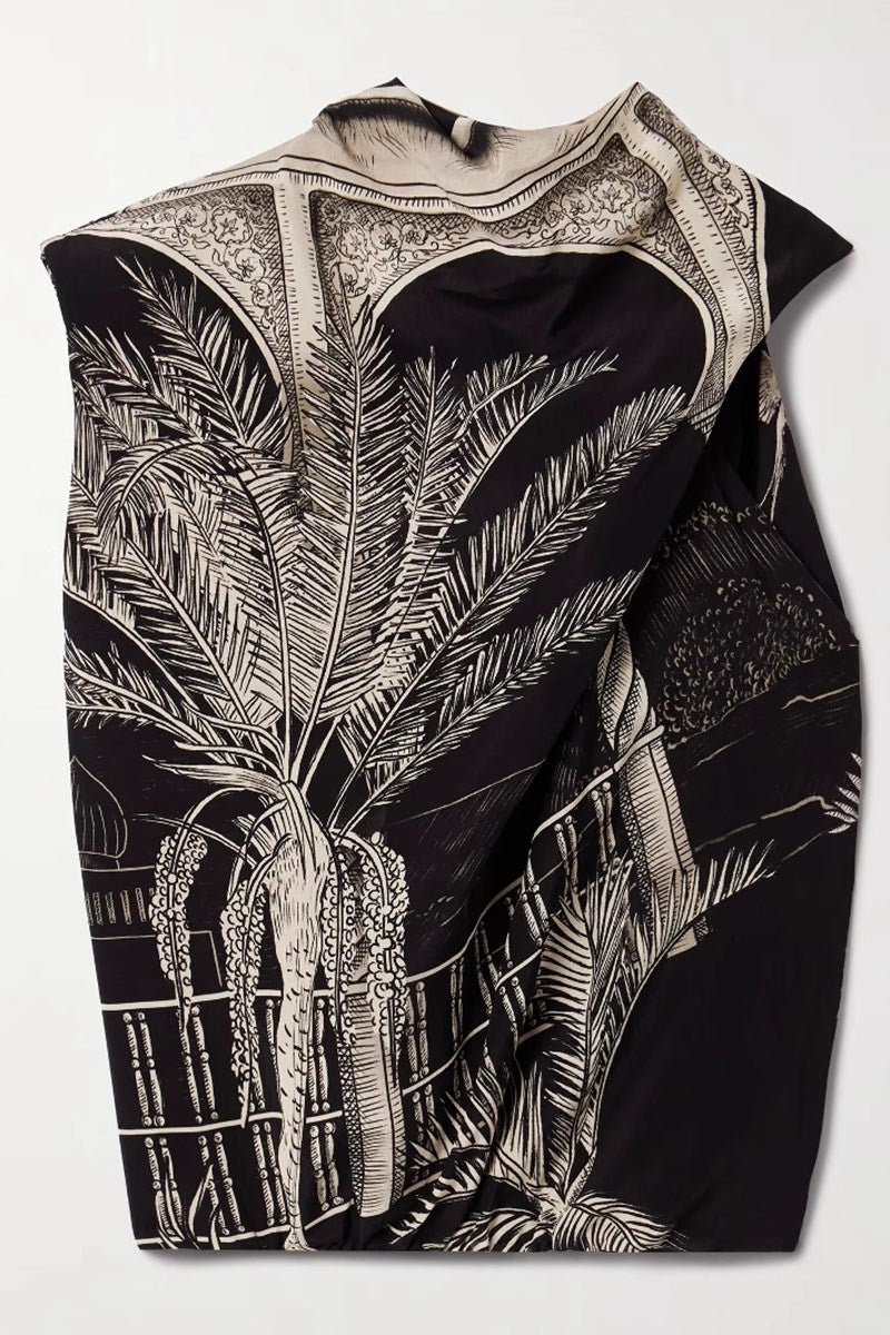 Flat lay detail of the skirt's architectural palm print design.