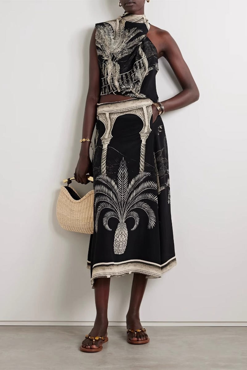 Full outfit front view, model standing straight in matching cami and skirt set with woven handbag.