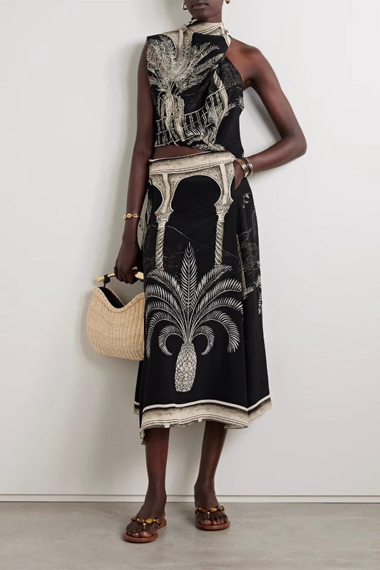 Full outfit front view, model standing straight in matching cami and skirt set with woven handbag.