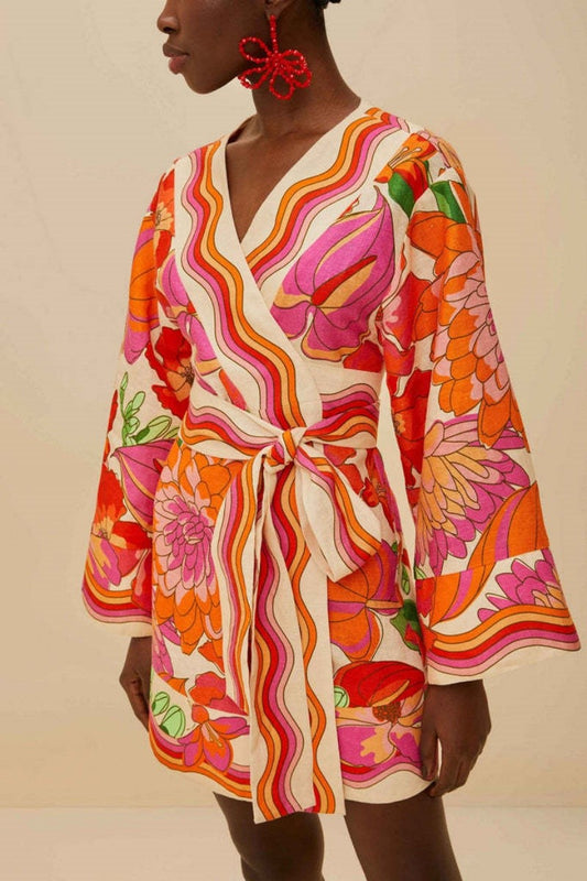 Side angle of floral mini dress highlighting vibrant print and relaxed fit